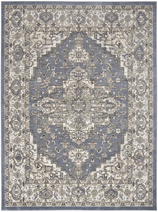 Blue-gray oriental rug with ivory border and an intricate floral medallion motif.