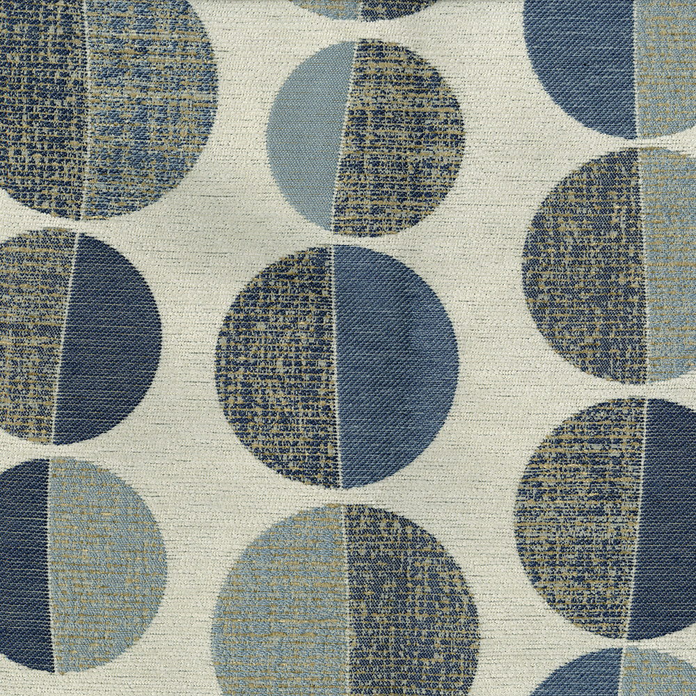 Geometric fabric with oversized split-color circles in blues and beige on cream background; mid-century modern pattern.
