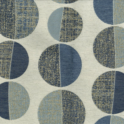 Geometric fabric with oversized split-color circles in blues and beige on cream background; mid-century modern pattern.