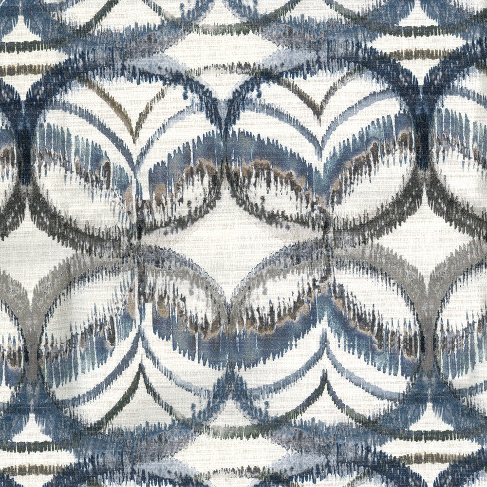 Woven textile in blue, gray, and beige with a repeating scalloped arc motif; ikat-inspired geometric fabric.