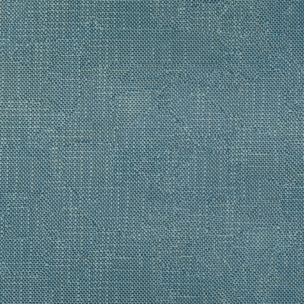 Teal-blue woven fabric close-up with a tight, denim-like texture.
