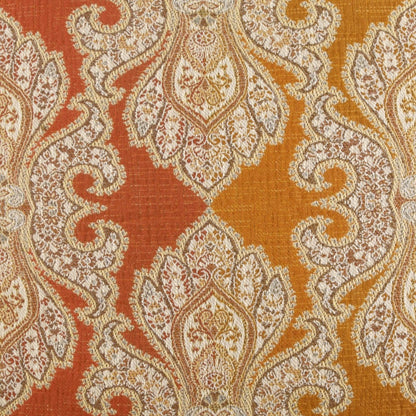 Rust-orange damask fabric with ivory ornate floral medallions; luxurious upholstery or drapery textile.