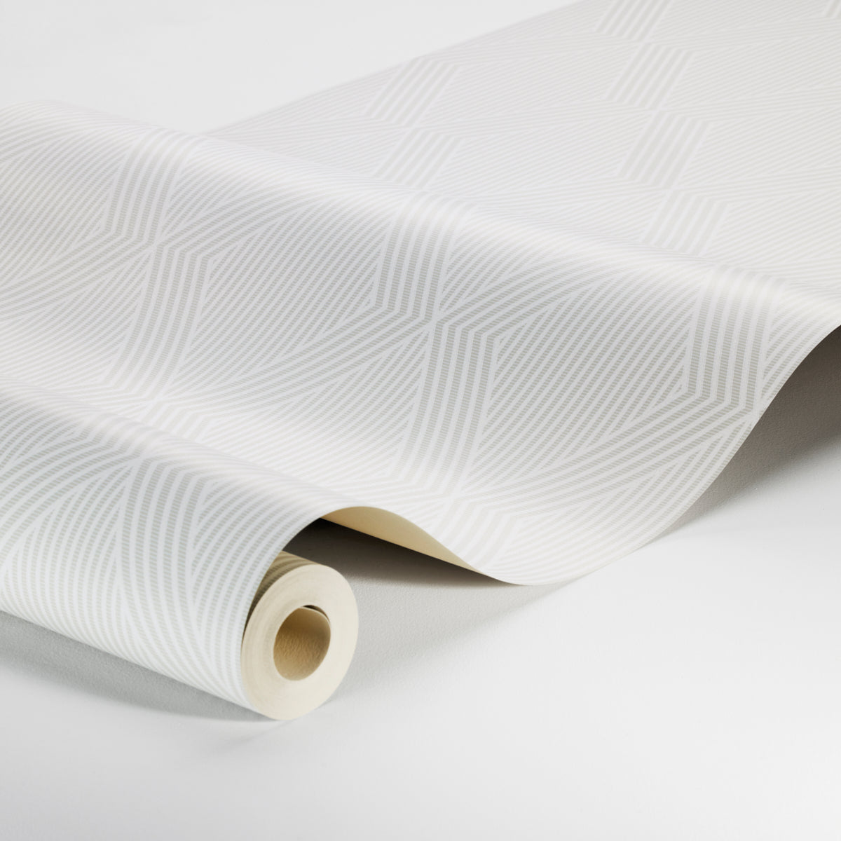 White wallpaper with subtle geometric linear pattern, rolled on a cardboard tube; modern decorative wall covering.