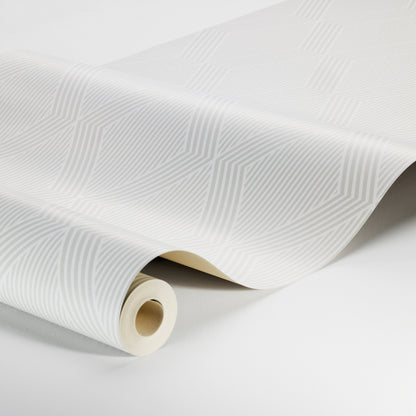 White wallpaper with subtle geometric linear pattern, rolled on a cardboard tube; modern decorative wall covering.