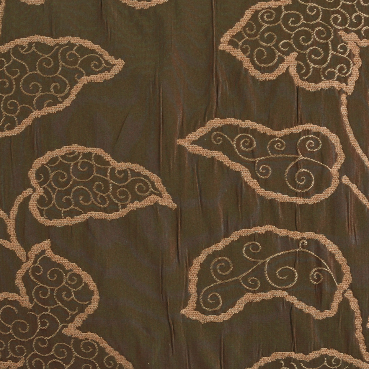 Dark brown fabric with tan cloud-like scrolling embroidery patterns and swirled motifs.
