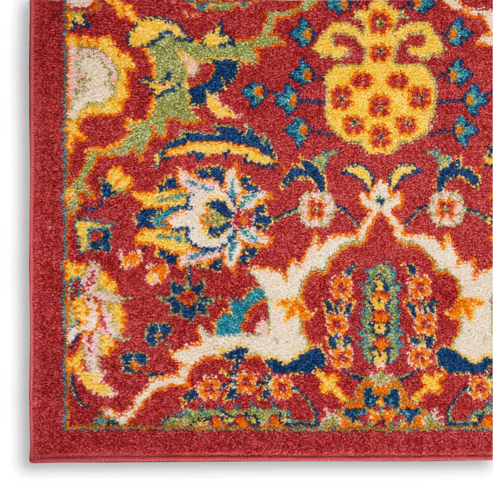 Rectangular red oriental-style rug corner with bold yellow & blue floral motifs, cream border; plush woven pile.