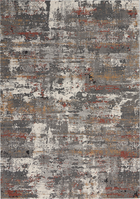 Rectangular abstract area rug with a distressed pattern in gray, ivory, rust and tan; modern living room decor.