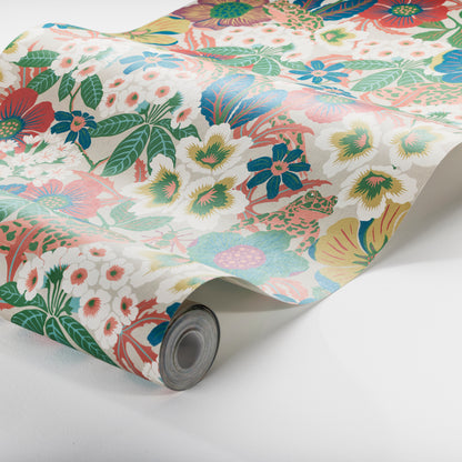 Rolled wallpaper with vivid multicolor floral pattern - red, blue, yellow flowers and green leaves.