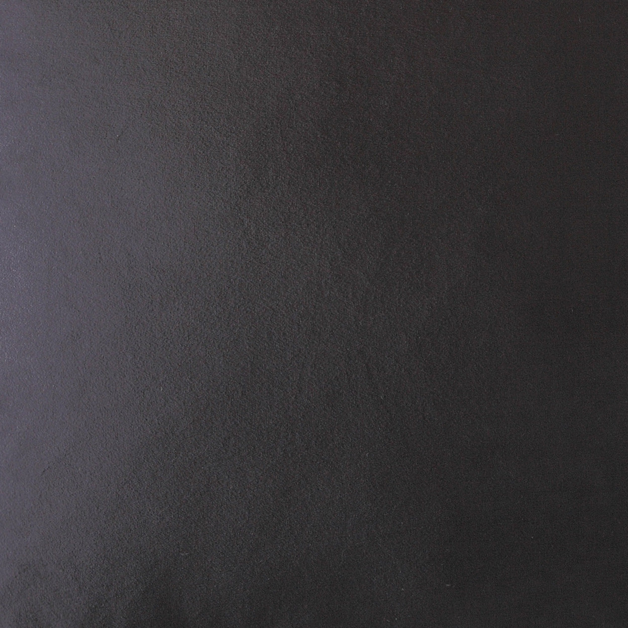 Close-up of dark charcoal suede texture with a subtle purple undertone on a 24" x 24" pillow; solid black.