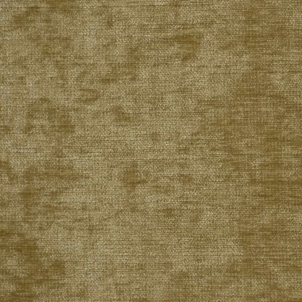 Golden-brown velvet upholstery fabric with a soft, plush texture and subtle mottling.