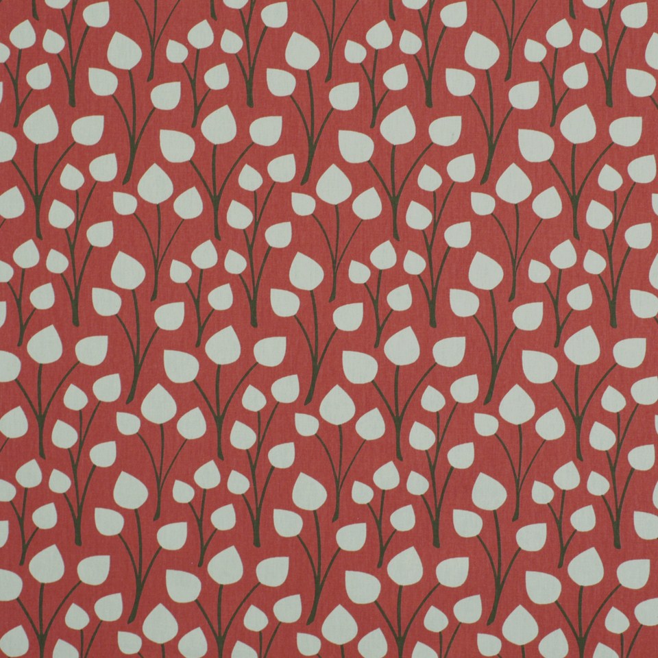 Coral fabric with white leaf silhouettes and dark stems; botanical pattern suitable for drapery.