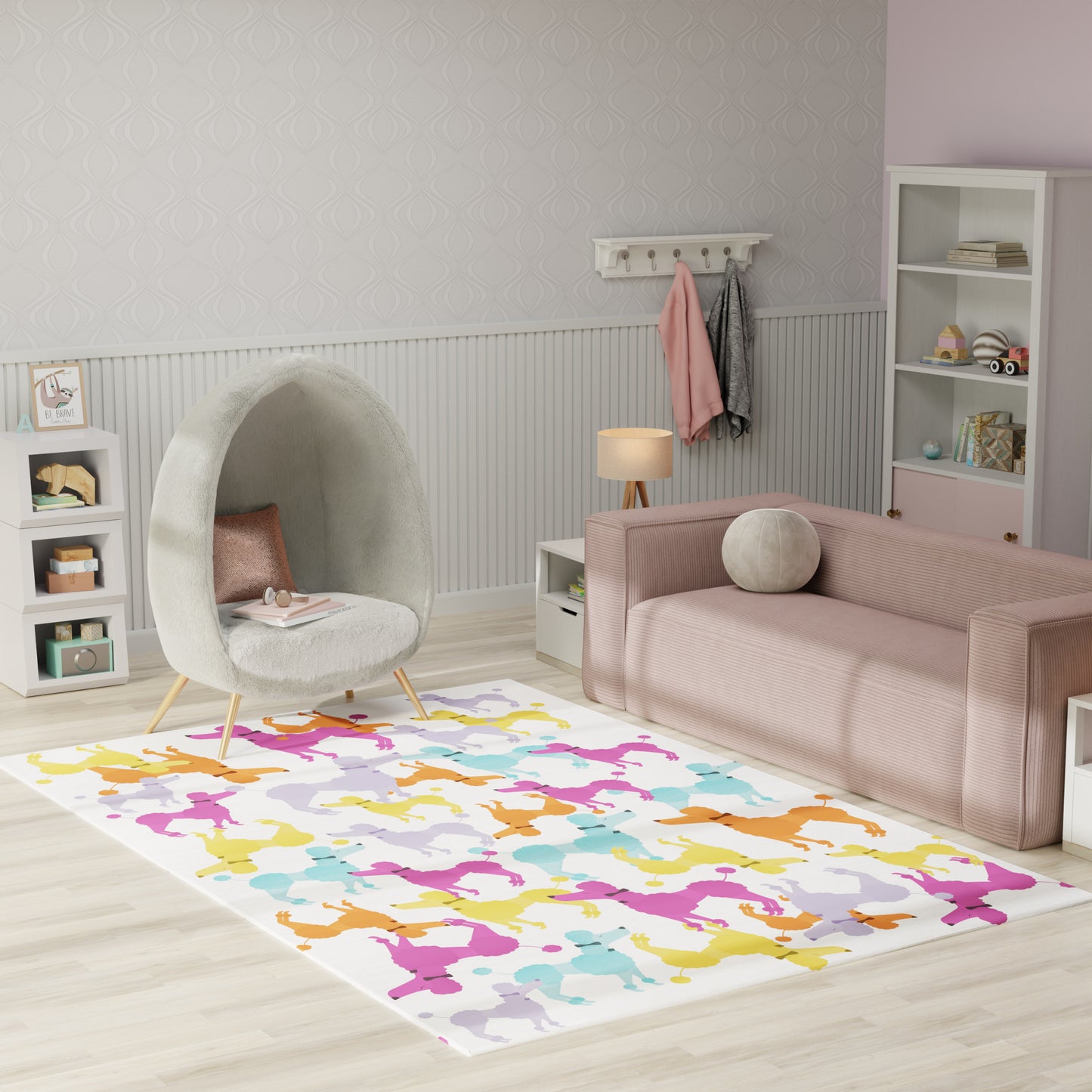 Pastel kids' room with a grey round fuzzy egg chair, blush pink sofa, colorful silhouette rug, white shelves.