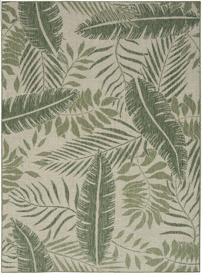 Woven rug with tropical palm leaf pattern in olive and sage greens on a beige backdrop.