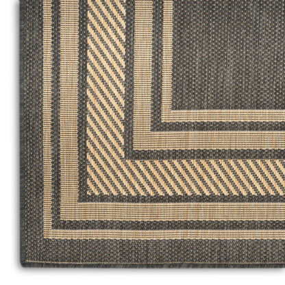 Beige & charcoal woven rug with concentric rectangular borders; coarse sisal-like texture and geometric pattern.