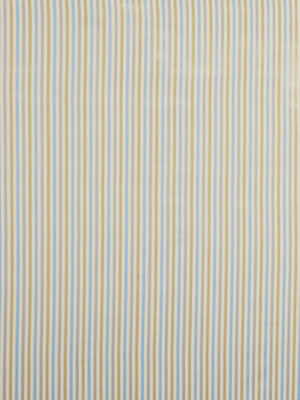 Pastel zigzag lines in blue, beige and yellow on chambray upholstery fabric.