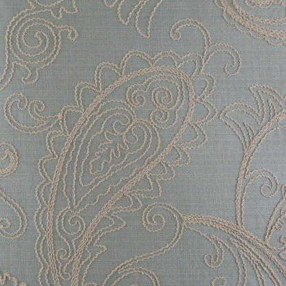 Light blue linen pillow with cream embroidered paisley scrolls, 24 x 24 in.