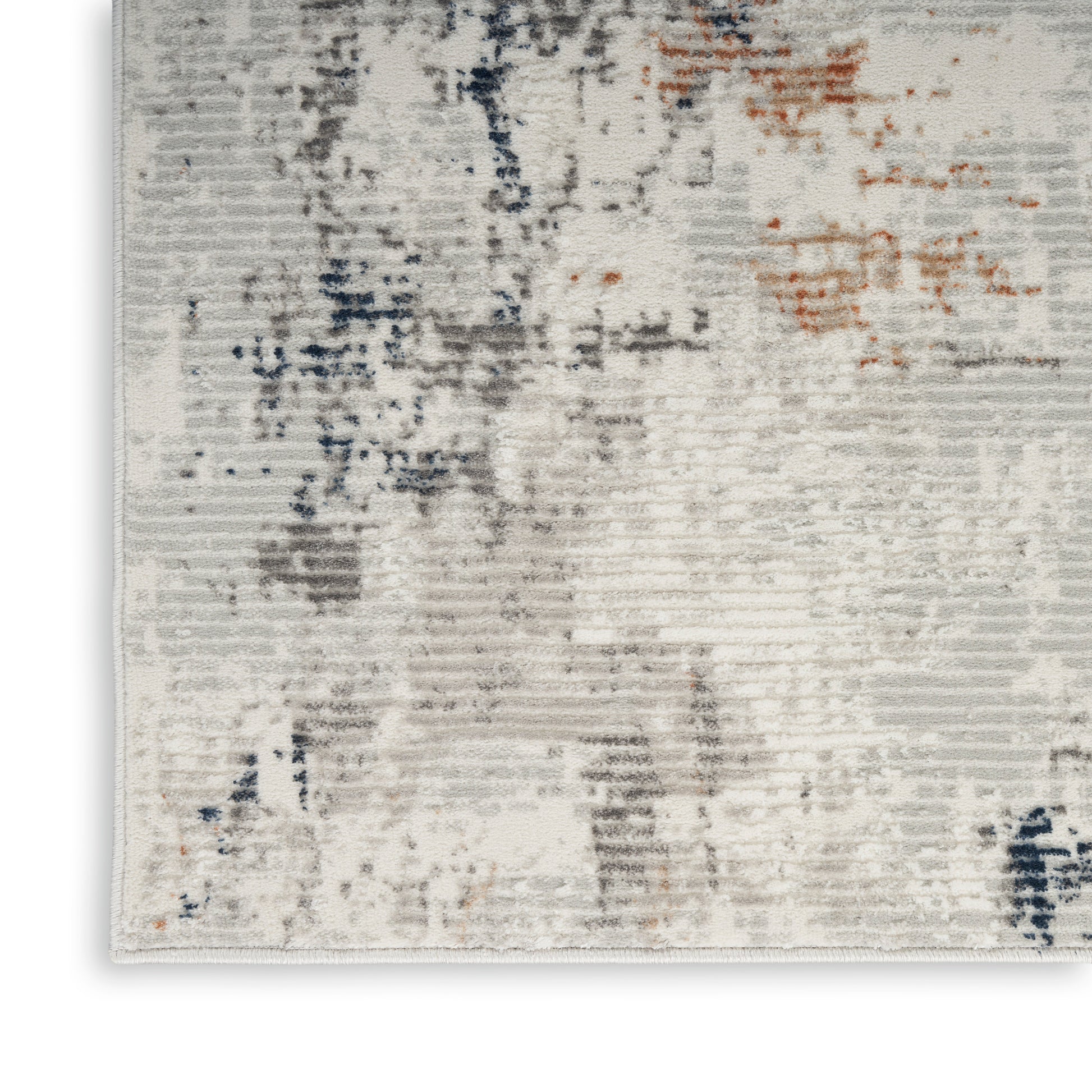 Abstract beige-gray area rug with subtle blue and orange accents, soft pile, modern decor for living room.