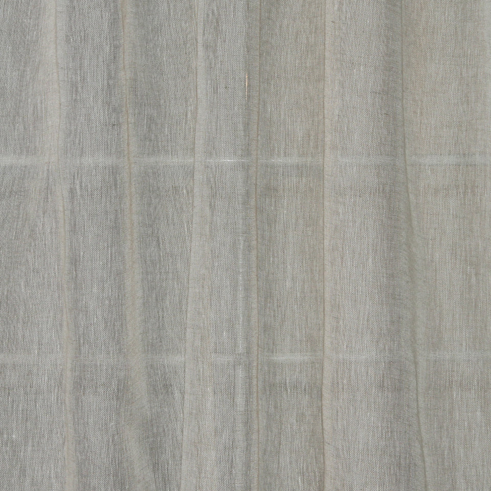 Light gray sheer drapery panel with vertical folds and subtle woven texture.
