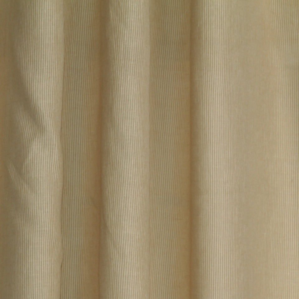 Beige corduroy drapery fabric with narrow vertical wales; soft, textured textile.
