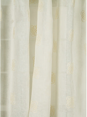 Oyster sheer curtains with subtle circular embroidery and a lightweight drape for windows