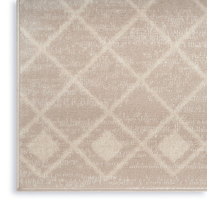 Beige plush area rug with a subtle diamond lattice pattern; soft, low-pile texture.