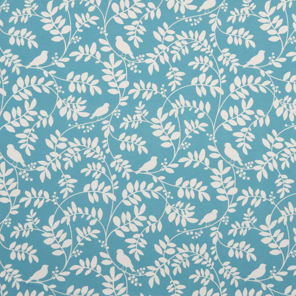 Teal blue drapery fabric featuring white botanical vines, leaves and perched birds in a repeating decorative pattern.