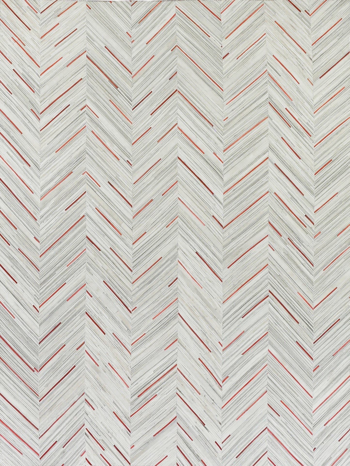 Chevron herringbone repeating pattern with pale gray lines and red accents on a rug.