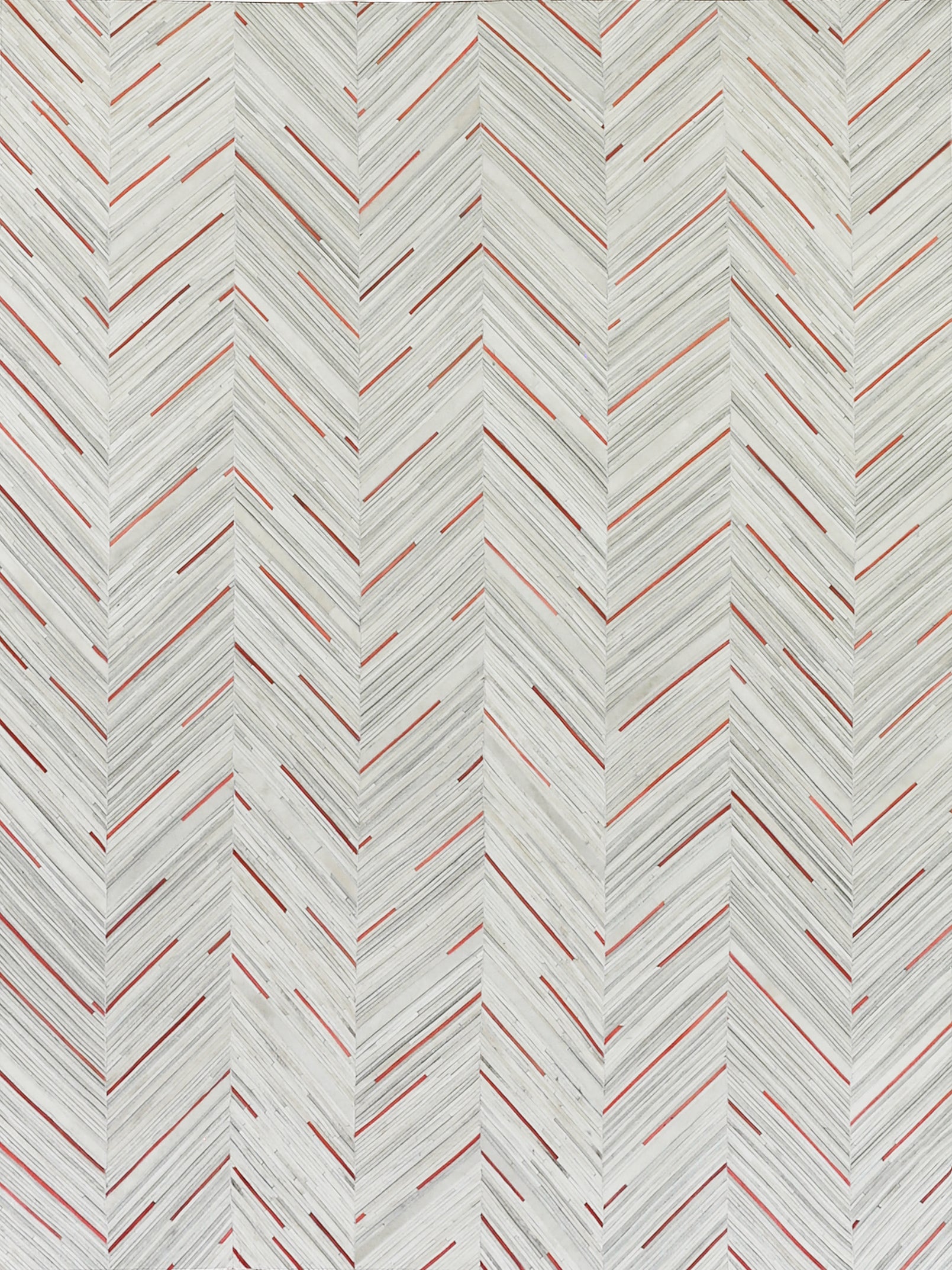 Chevron herringbone repeating pattern with pale gray lines and red accents on a rug.