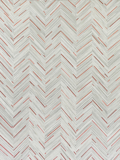 Chevron herringbone repeating pattern with pale gray lines and red accents on a rug.