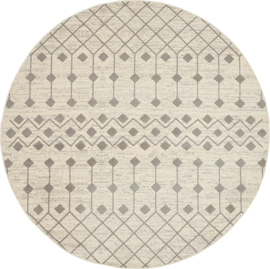 Round beige rug with taupe diamond lattice pattern and decorative band accents.