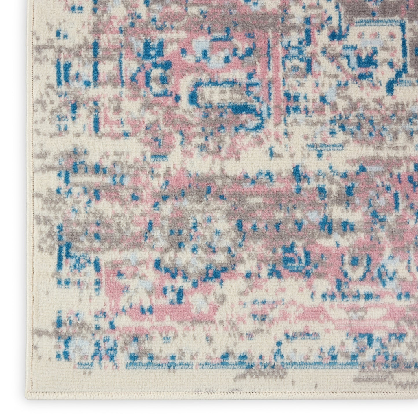 Abstract distressed area rug with pink, blue and gray on cream, rectangular shape, modern vintage look.