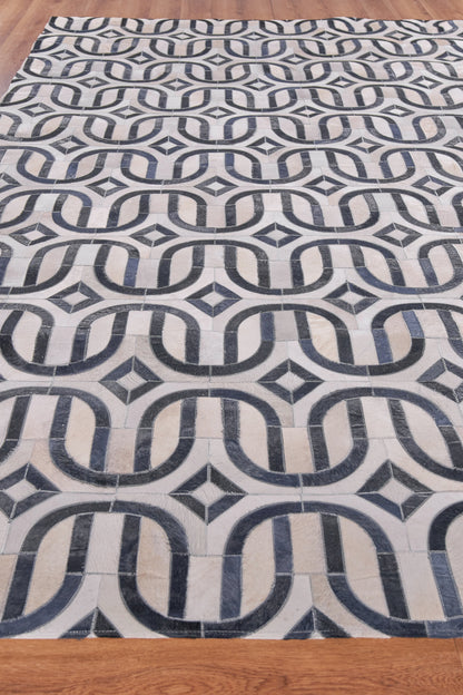 Natural hide indoor hand-stitched rug; rectangular area rug.