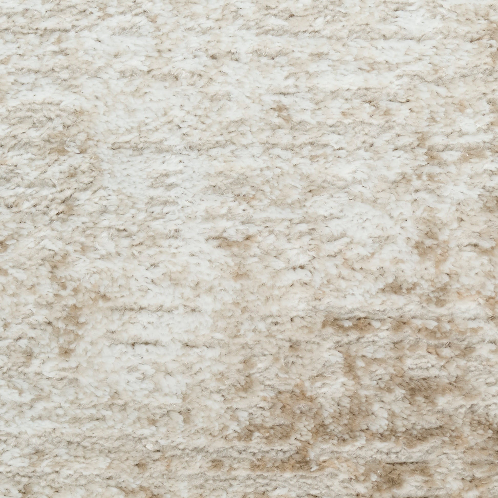 Cream beige shag rug with plush, high-pile texture for cozy decor.