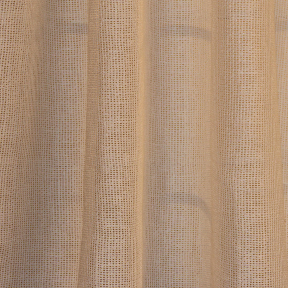White sheer woven curtain fabric with soft vertical folds and relaxed drape.