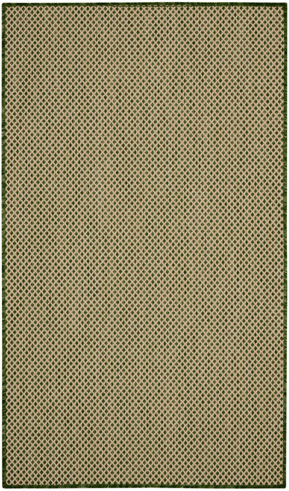 Beige area rug with tiny green diamond lattice pattern and dark green border
