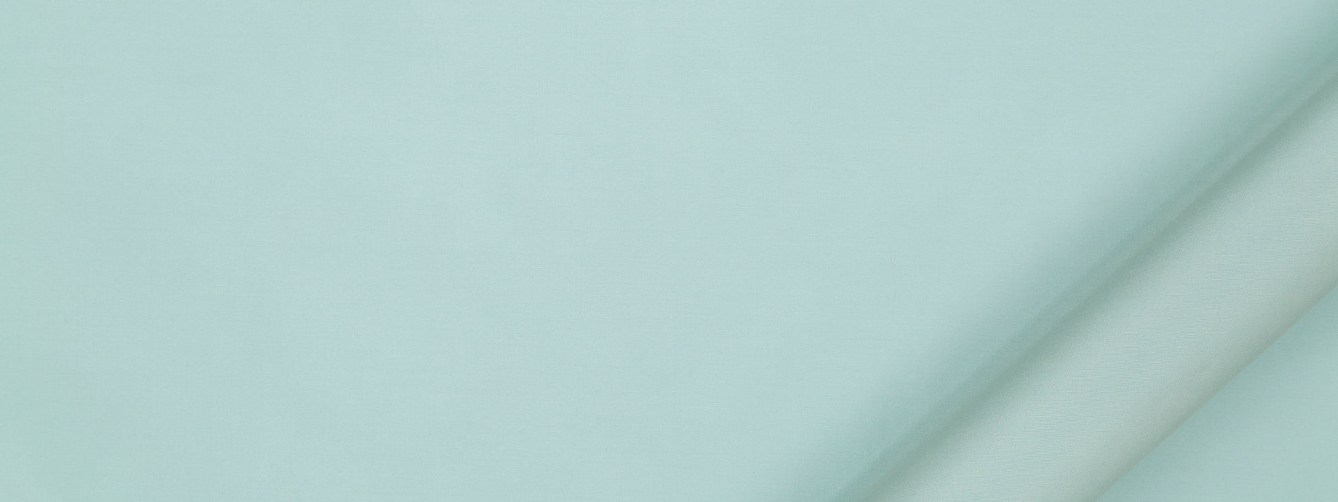 Mint teal fabric with a diagonal rolled edge on the right, smooth matte surface for sewing or crafts.
