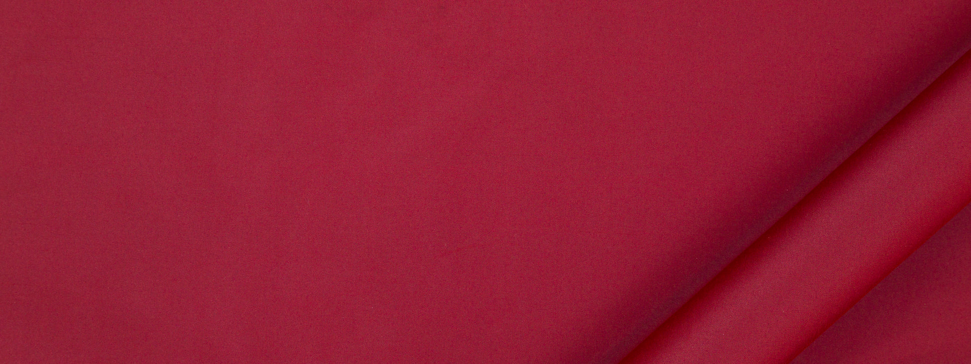 Crimson fabric with a diagonal fold and smooth matte texture; multipurpose fabric.