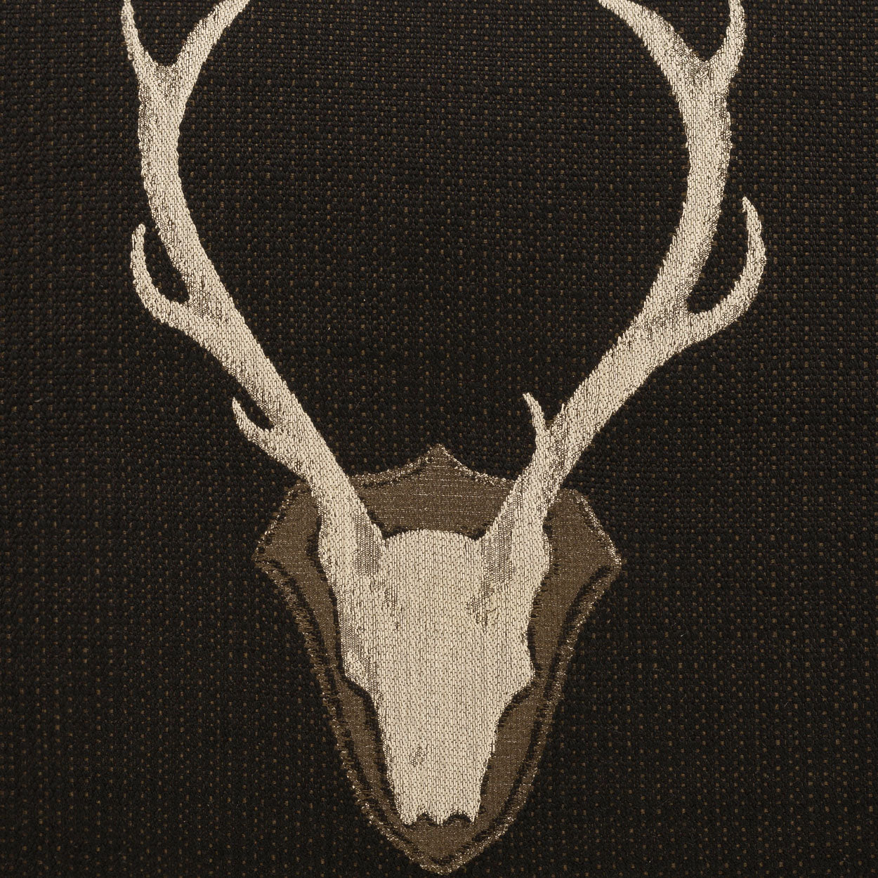 White deer skull with antlers on a brown shield fabric patch; rustic woodland motif for jackets.