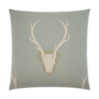 Grey-blue knitted square throw pillow with beige deer skull and antler motif; rustic woodland decor.