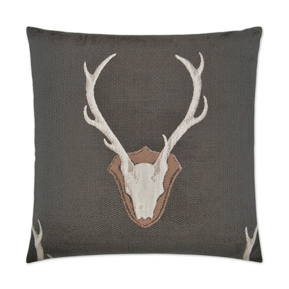 Grey textured throw pillow with a white deer skull and antlers on a shield crest.