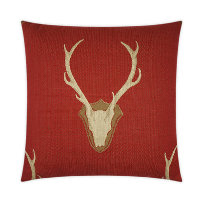 Red square throw pillow with cream deer skull and antlers on textured fabric.