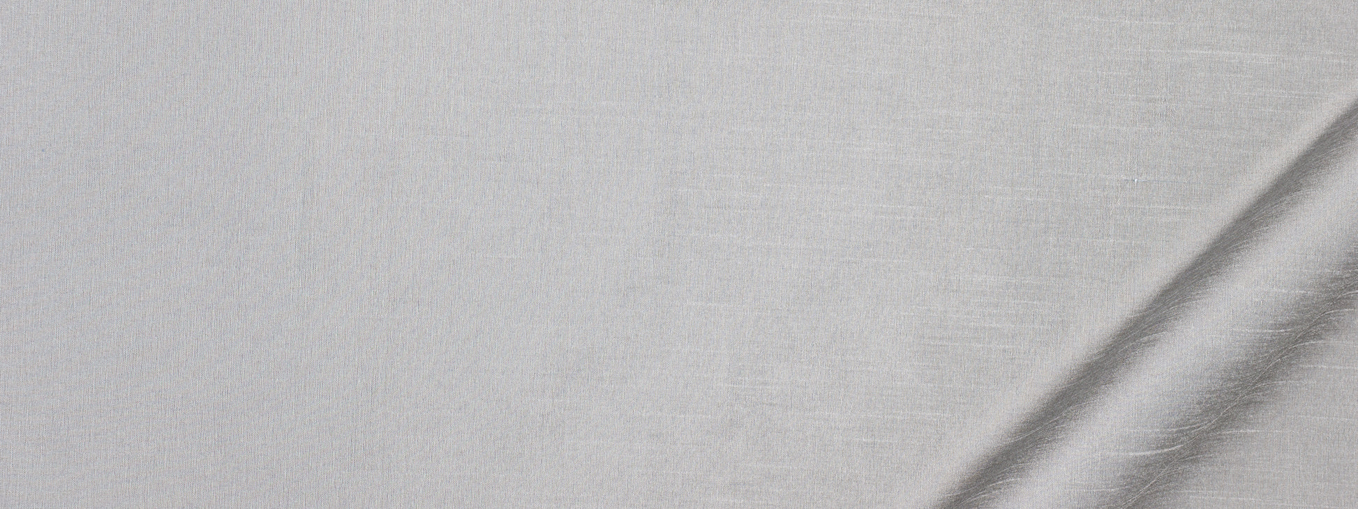 Light gray linen fabric texture with subtle weave; slight diagonal fold at bottom-right for drape and upholstery use.