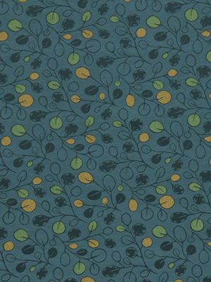 Teal background fabric with navy vines, dark leaves, and small green and yellow fruit circles; seamless botanical pattern.