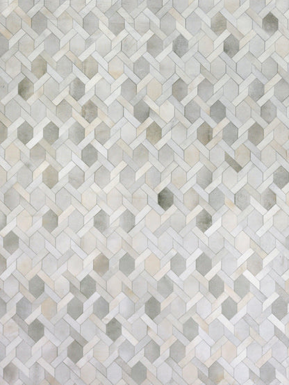 Natural hide indoor hand-stitched rug in light gray and beige tones; textured hide with subtle variation, 5' x 8'.