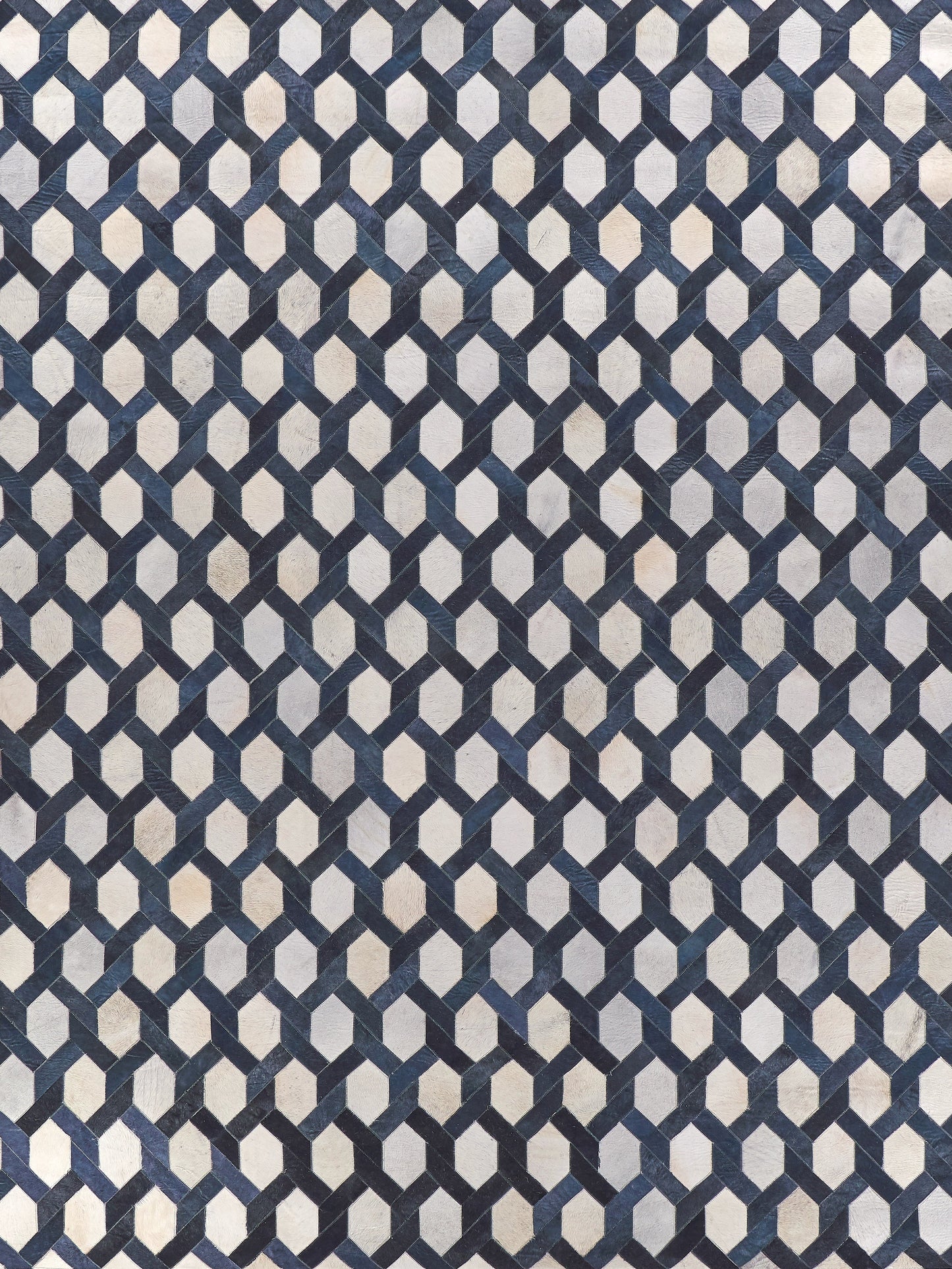 Navy and light gray interlocking hex chain pattern rug, natural hide, indoor hand-stitched, 5' x 8'.