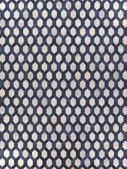 Navy and light gray interlocking hex chain pattern rug, natural hide, indoor hand-stitched, 5' x 8'.