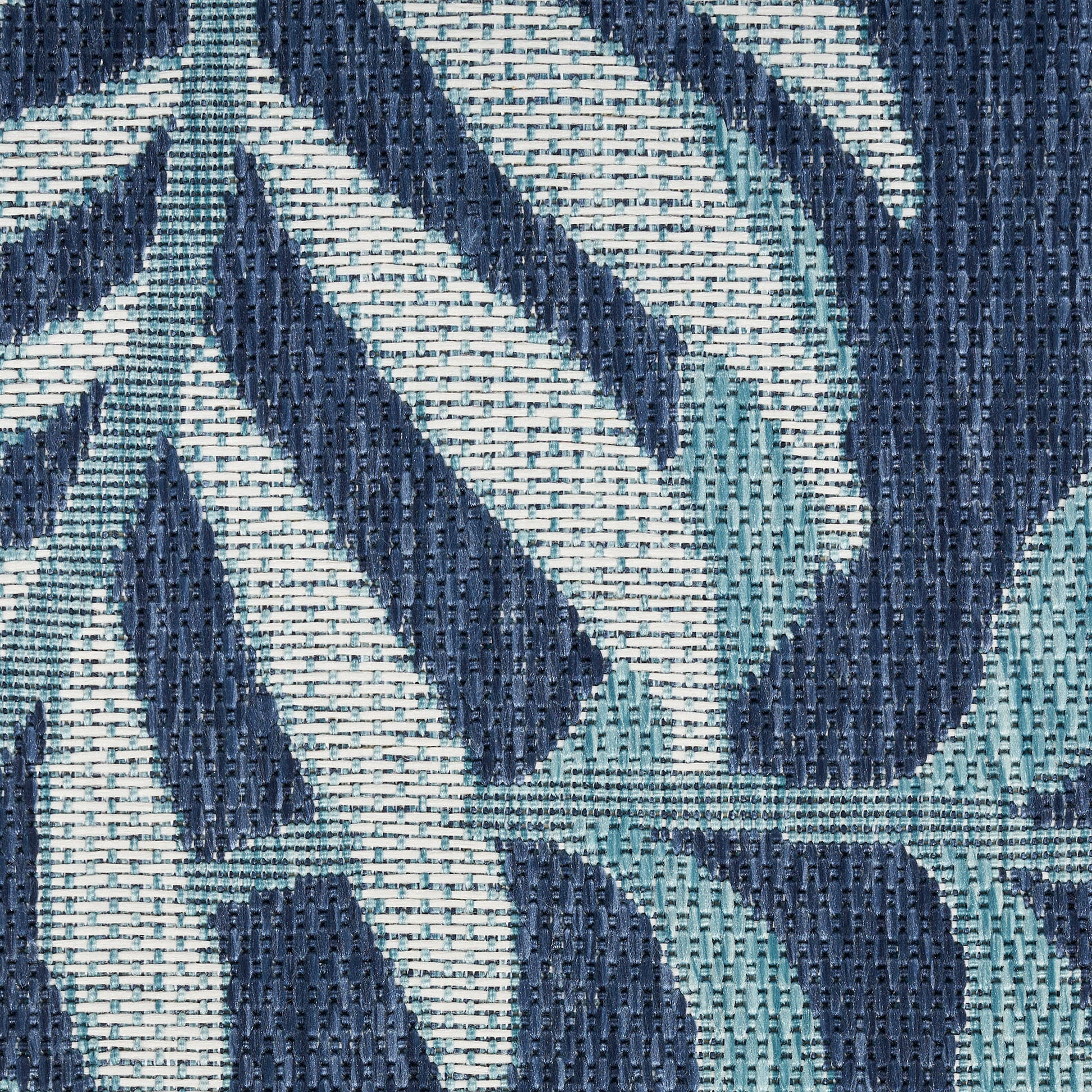 Textured woven rug in navy blue and teal with a geometric leaf pattern; size 9' x 12'.
