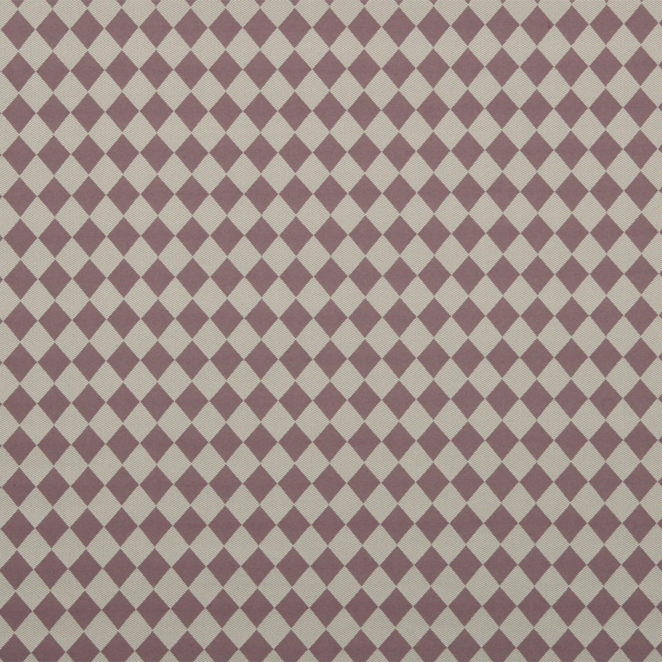 Beige and mauve diamond harlequin pattern on drapery fabric.