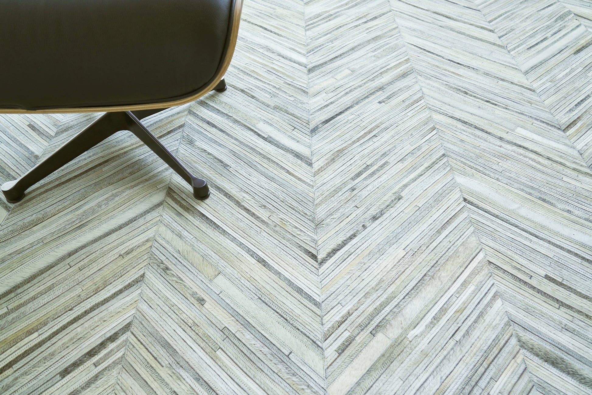 Natural hide indoor hand-stitched rug, 2162-5'X8'.