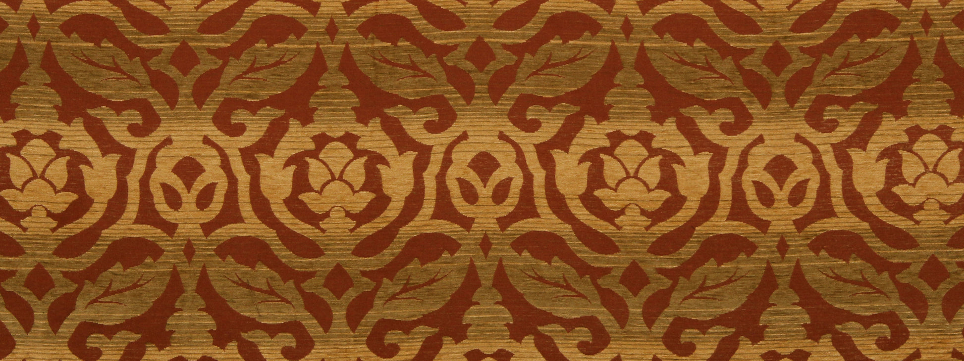 Gold and brown damask fabric pattern with scrolling floral motifs, ornate upholstery style.